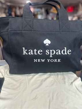 kate spade black canvas tote with white logo . New no tag